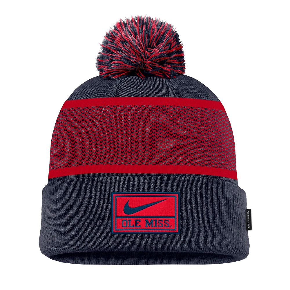 Youth Nike Navy Ole Miss Rebels 2024 Sideline Peak Cuffed Knit Hat with Pom