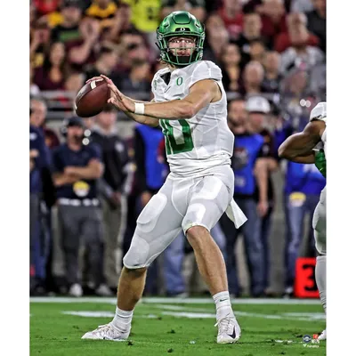 Justin Herbert Oregon Ducks Unsigned White Jersey Warming Up Photograph