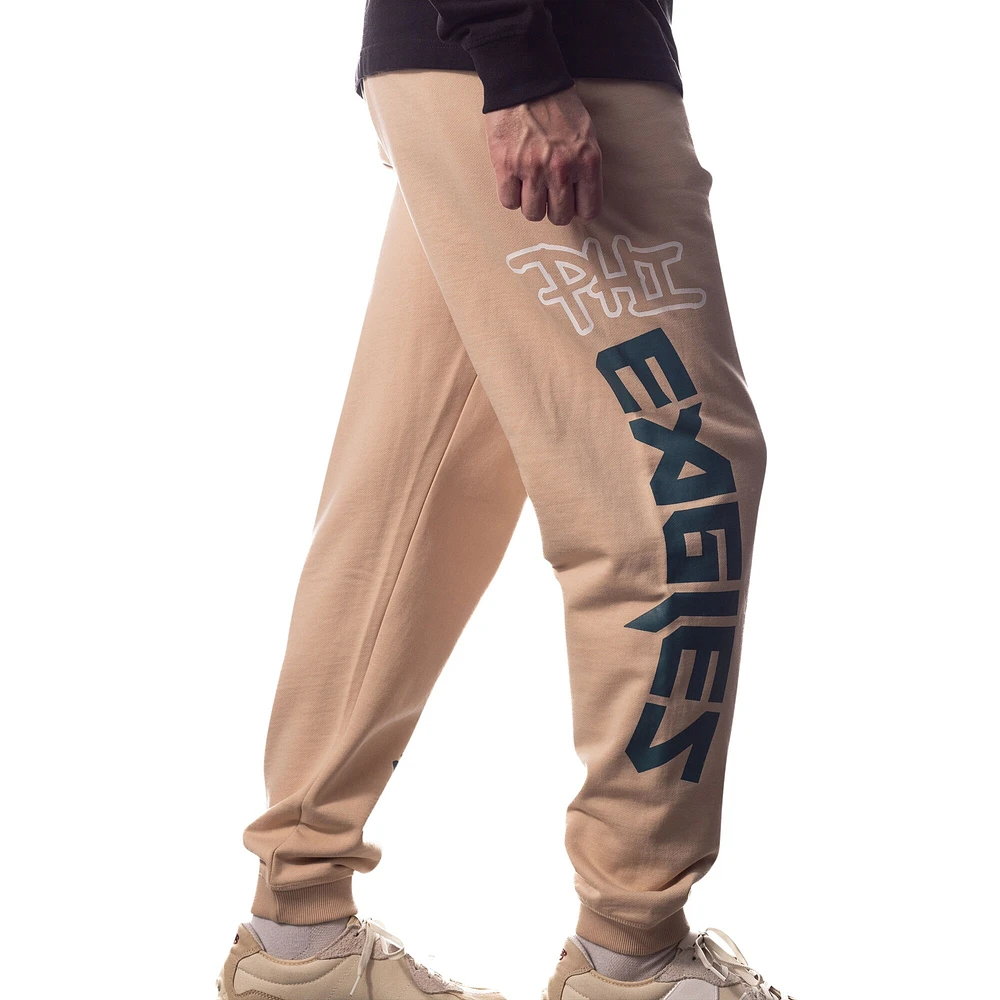 Pantalon de jogging unisexe The Wild Collective crème Philadelphia Eagles Heavy Block Graphic Jogger