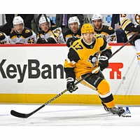 Bryan Rust Pittsburgh Penguins Unsigned Gold Alternate Jersey Skating vs. Boston Bruins Photograph