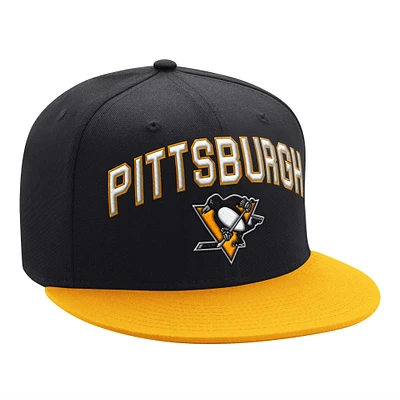 Casquette Snapback bicolore avec logo en arc des Penguins de Pittsburgh Starter noir/or pour hommes