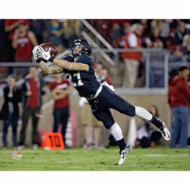 Christian McCaffrey Stanford Cardinal Unsigned White Jersey Leaps Over Line  vs. Arizona Wildcats Photograph