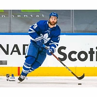 T.J. Brodie Toronto Maple Leafs Unsigned Blue Jersey Skating with Puck vs. Montreal Canadiens Photograph