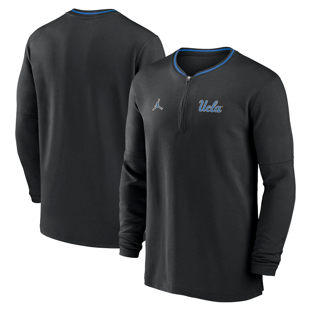 Haut à manches longues demi-zip Jordan Brand noir pour hommes UCLA Bruins 2024 Sideline Coach Performance