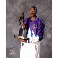 Shaquille O'Neal Miami Heat Unsigned Red Alternate Jersey Posing with Larry O'Brien Championship Trophy Photograph