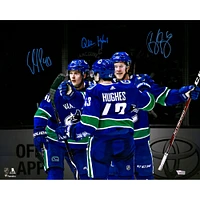 Brock Boeser Elias Pettersson & Quinn Hughes Vancouver Canucks Multi-Signed 16" x 20" Spotlight Photograph