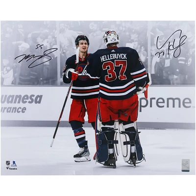 Connor Hellebuyck & Mark Scheifele Winnipeg Jets Autographed 16" x 20" Navy Alternate Jersey Celebration Spotlight Photograph