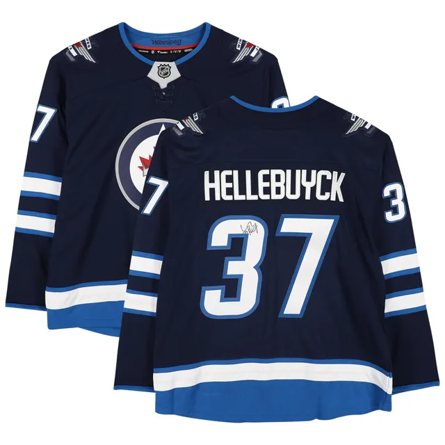 Connor Hellebuyck Winnipeg Jets Unsigned Reverse Retro Jersey In Net  Photograph