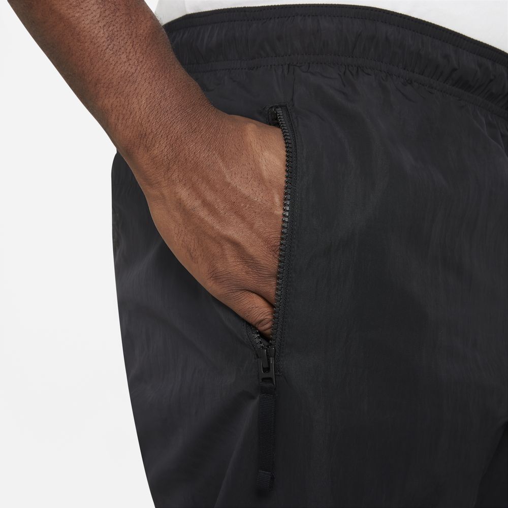 NIKE WOVEN TAPERED LEG PANT