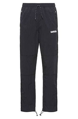 Bas de survêtement Relaxed Fit avec logo exclusif