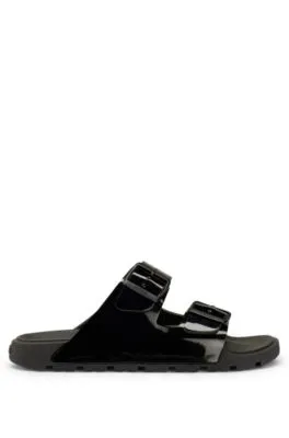 Glossy twin-strap sandals with logo buckles