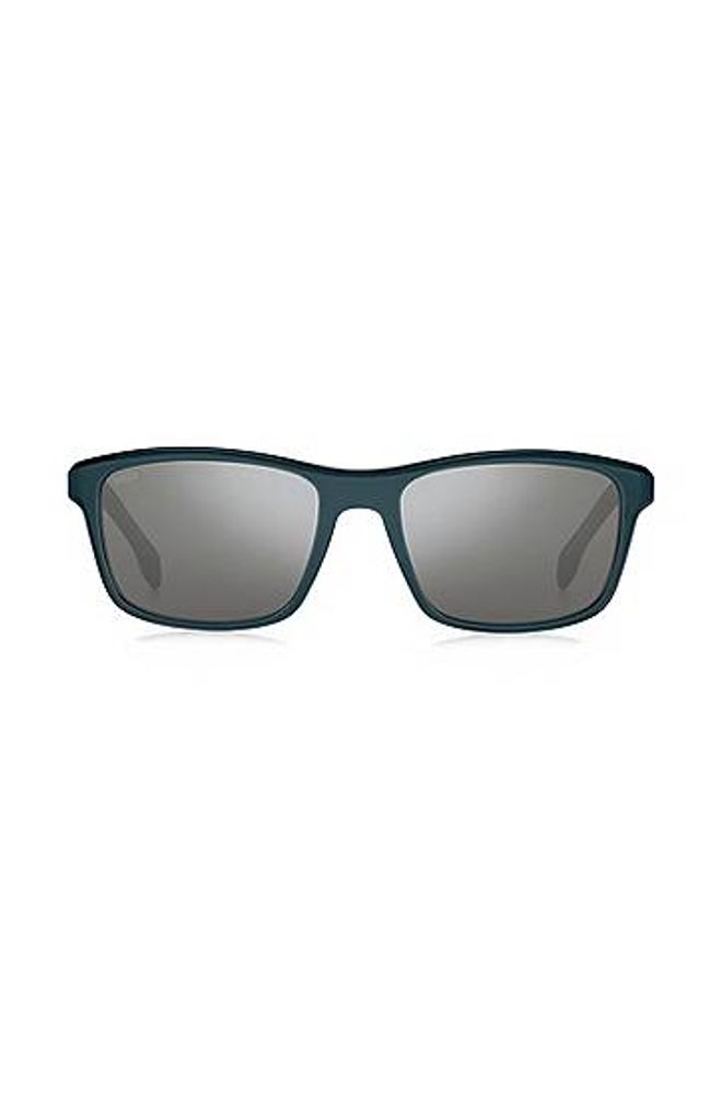 Lunettes de soleil en acétate bleu sarcelle mat avec finitions en métal