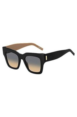 Lunettes de soleil en bio-acétate noir avec garnitures en métal emblématiques