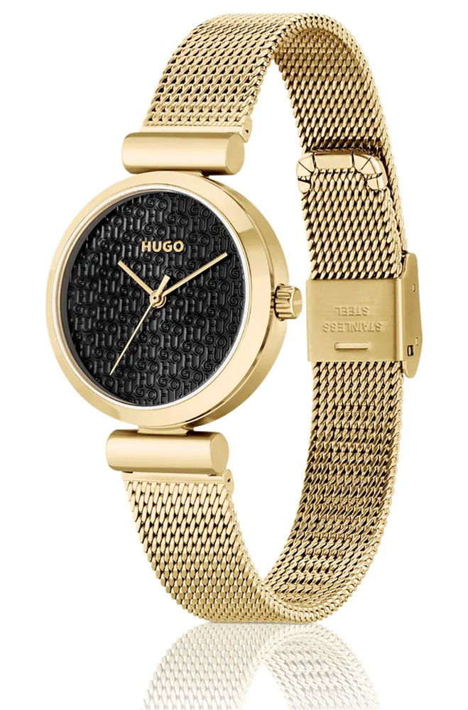 Montre dorée avec cadran à logos superposés