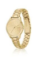 Montre dorée à cadran monogrammé