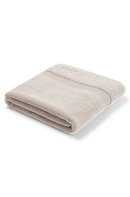 Tapis de bain en coton de la mer Égée beige clair à logo brodé