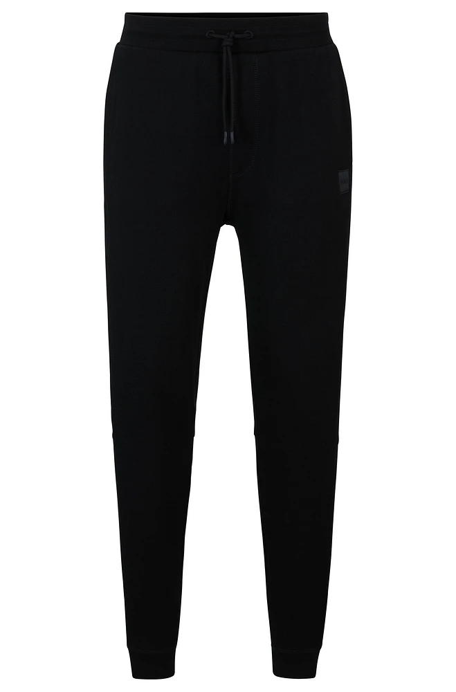 Cotton-terry tracksuit bottoms with logo patch