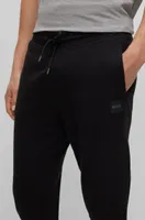 Cotton-terry tracksuit bottoms with logo patch