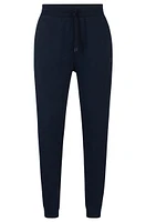 BOSS - Cotton-terry tracksuit bottoms with logo patch Dark Blue