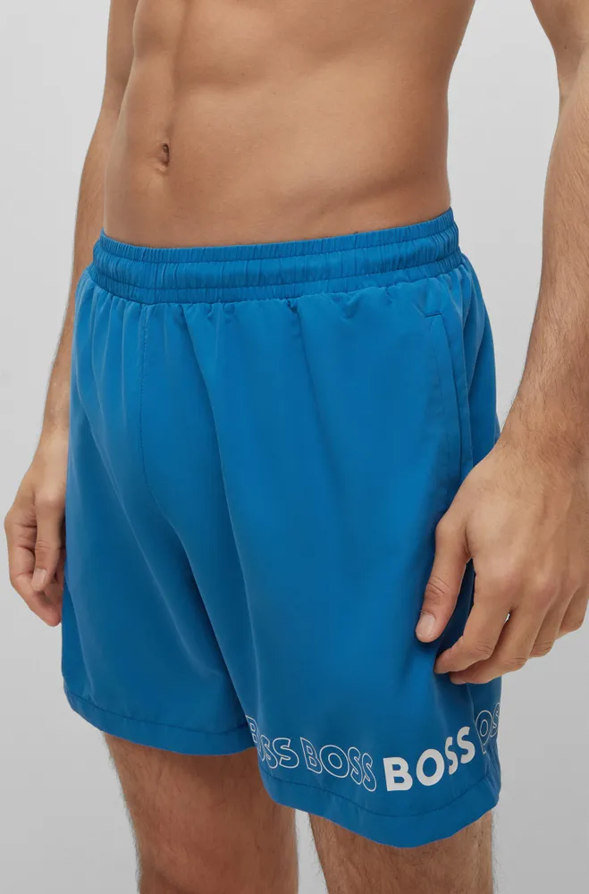 Swim shorts with repeat logos