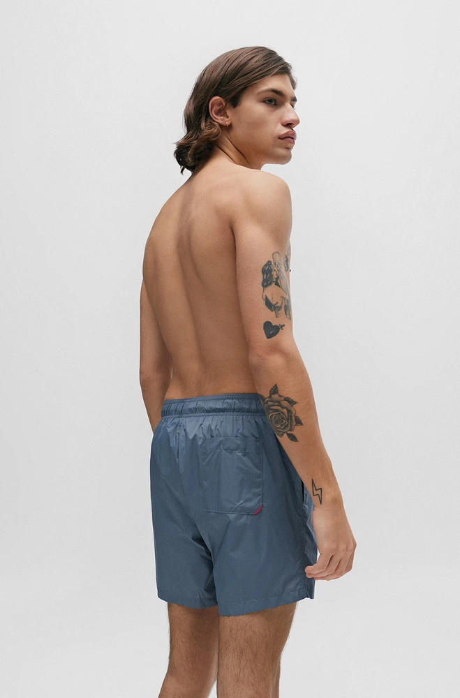 Fully lined swim shorts with logo print