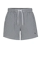 Seersucker striped swim shorts with logo badge