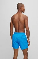 Quick-dry swim shorts with large logo print