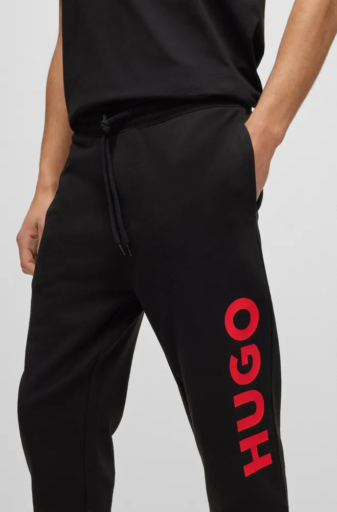 HUGO - Cuffed tracksuit bottoms in French terry with contrast logo