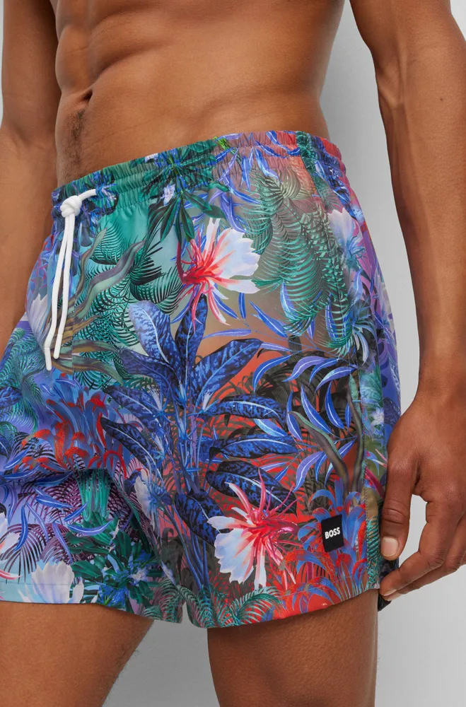 Bañador tipo shorts con estampado de flores y detalle logo