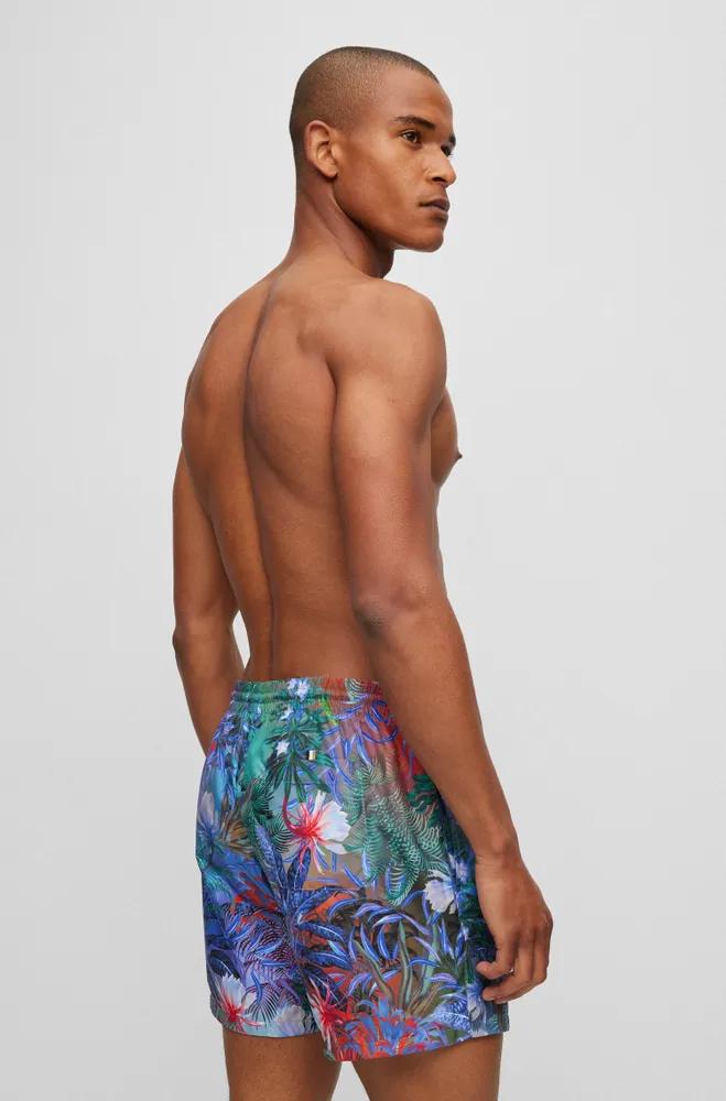 Bañador tipo shorts con estampado de flores y detalle logo