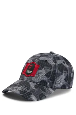 Cotton-poplin cap with camouflage pattern and collaborative branding