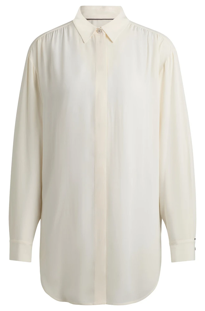 Long-length relaxed-fit blouse with concealed closure