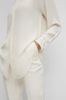 Long-length relaxed-fit blouse with concealed closure