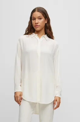 Long-length relaxed-fit blouse with concealed closure
