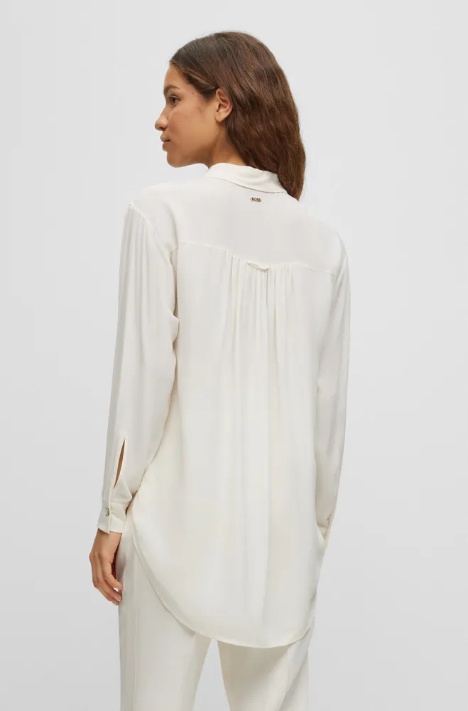 Long-length relaxed-fit blouse with concealed closure