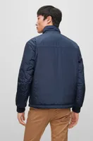 Water-repellent reversible jacket with logo badge