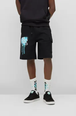 Cotton-terry shorts with graffiti-logo artwork