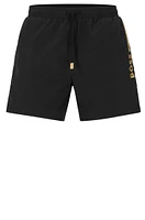 Quick-drying swim shorts with metallic logo