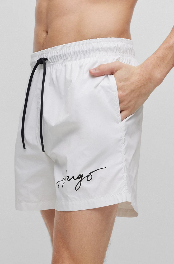 Swim shorts with handwritten logo