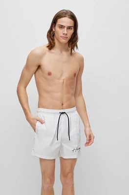 Swim shorts with handwritten logo