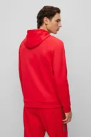 Stretch-interlock relaxed-fit hoodie with rhinestone logo