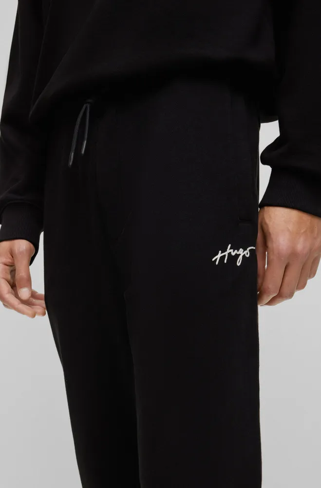 HUGO - Cotton-terry tracksuit bottoms with handwritten logo embroidery