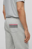 Pantalones de chándal mezcla algodón con logos bordados