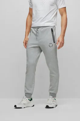 HUGO - Monogram-print tracksuit bottoms with striped tape