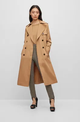 Double-breasted trench coat with belted closure