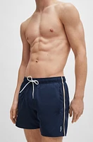 Swim shorts with signature stripe and logo