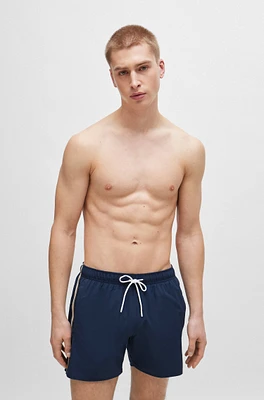 Swim shorts with signature stripe and logo