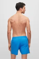 Swim shorts with signature stripe and logo