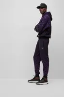 BOSS x Khaby Relaxed-fit cotton-blend tracksuit bottoms with gradient monograms