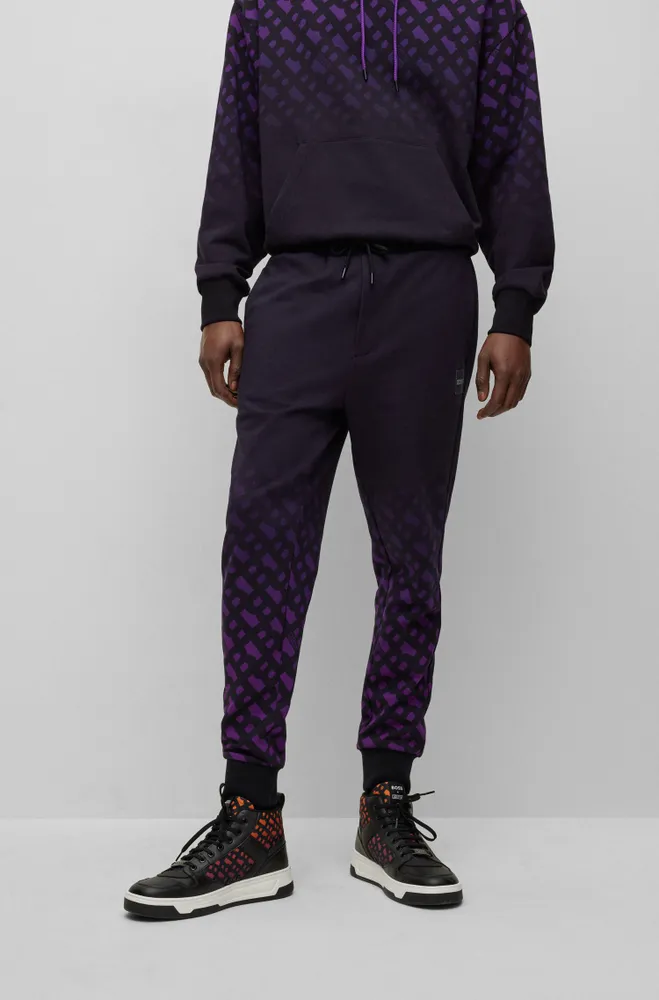 BOSS x Khaby Relaxed-fit cotton-blend tracksuit bottoms with gradient monograms